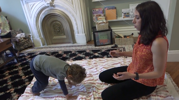Young boy doing Animal Yoga with Jocelyn teaching