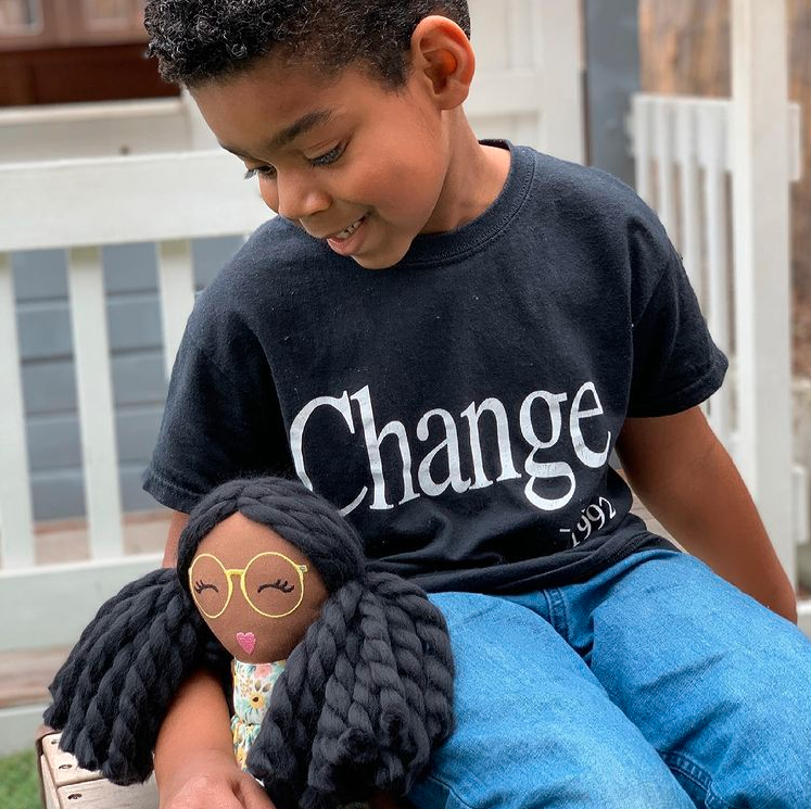 boy with modern doll studio doll and change shirt